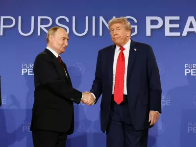 FILE PHOTO: U.S. President Donald Trump and Russian President Vladimir Putin shake hands during a press conference following their meeting to negotiate an end to the war in Ukraine, at Joint Base Elmendorf-Richardson, in Anchorage, Alaska, U.S., August 15, 2025. REUTERS/Kevin Lamarque/File Photo