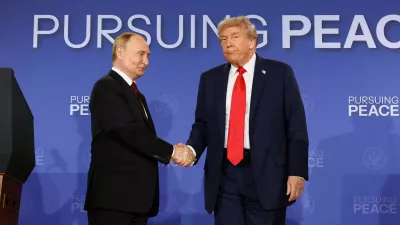 FILE PHOTO: U.S. President Donald Trump and Russian President Vladimir Putin shake hands during a press conference following their meeting to negotiate an end to the war in Ukraine, at Joint Base Elmendorf-Richardson, in Anchorage, Alaska, U.S., August 15, 2025. REUTERS/Kevin Lamarque/File Photo