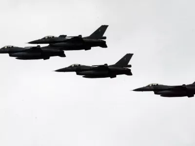 ** FILE ** Greek F-16 fighter jets participate in Independence Day celebrations in Athens on Saturday, March 25, 2006. A Greek F-16 fighter jet and a Turkish warplane collided as they shadowed each other Tuesday, and crashed near the Greek island of Karpathos in the Aegean Sea on Tuesday, May 23, 2006. (AP Photo/Thanassis Stavrakis, File)