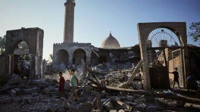 Palestinians inspect the Abu Salim Mosque a day after it was hit by an Israeli airstrike, in Deir al-Balah, central Gaza Strip, Tuesday, Aug. 25, 2026. (AP Photo/Abdel Kareem Hana)