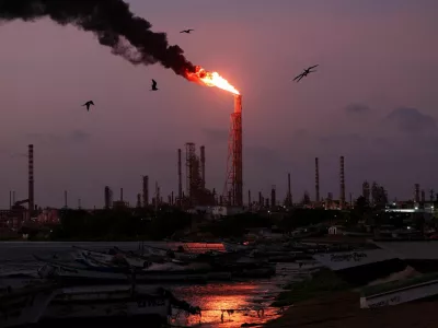 FILE PHOTO: A gas flare burns at the Cardon refinery, part of the Paraguana Refining Center, as years of underinvestment, equipment failures and shortages have hampered fuel production in Venezuela, in Punta Cardon, Venezuela, May 6, 2026. REUTERS/Gaby Oraa/File Photo