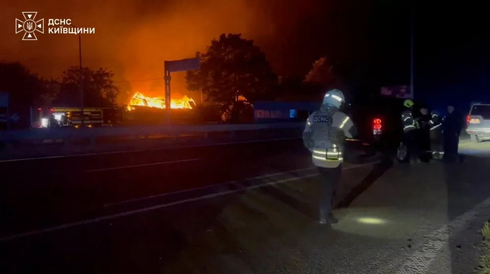 Emergency services work after a Russian drone strike on a Kyiv-area warehouse sparked a detonation, according to officials, in a location given as Myla, Kyiv Region, Ukraine, in this screen grab obtained from a handout video released August 29, 2026. State Emergency Service Of Ukraine/Handout via REUTERS  THIS IMAGE HAS BEEN SUPPLIED BY A THIRD PARTY. MANDATORY CREDIT. WATERMARK FROM SOURCE. VERIFICATION: -Buildings, steeple and car park matched satellite and archive imagery -Date could not be verified, but statement from Kyiv governor on August 29 said at least 27 people were killed in the strike on the Kyiv area