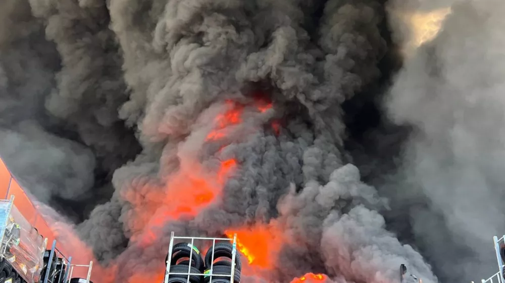 In this photo provided by the Ukrainian Emergency Service, firefighters put out a fire in a warehouse following a Russian drone attack near Kyiv, Ukraine, Saturday, Aug. 29, 2026. (Ukrainian Emergency Service via AP)
