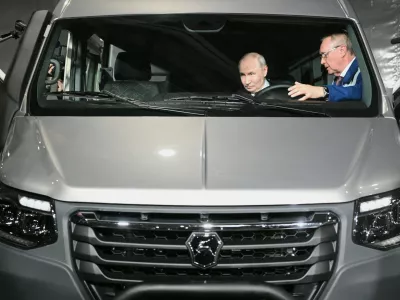 Russian President Vladimir Putin, left, visits the Nizhny Novgorod automobile cluster, in Nizhny Novgorod, Russia, Friday, Aug. 28, 2026. (Kirill Zykov/Sputnik, Kremlin Pool Photo via AP)