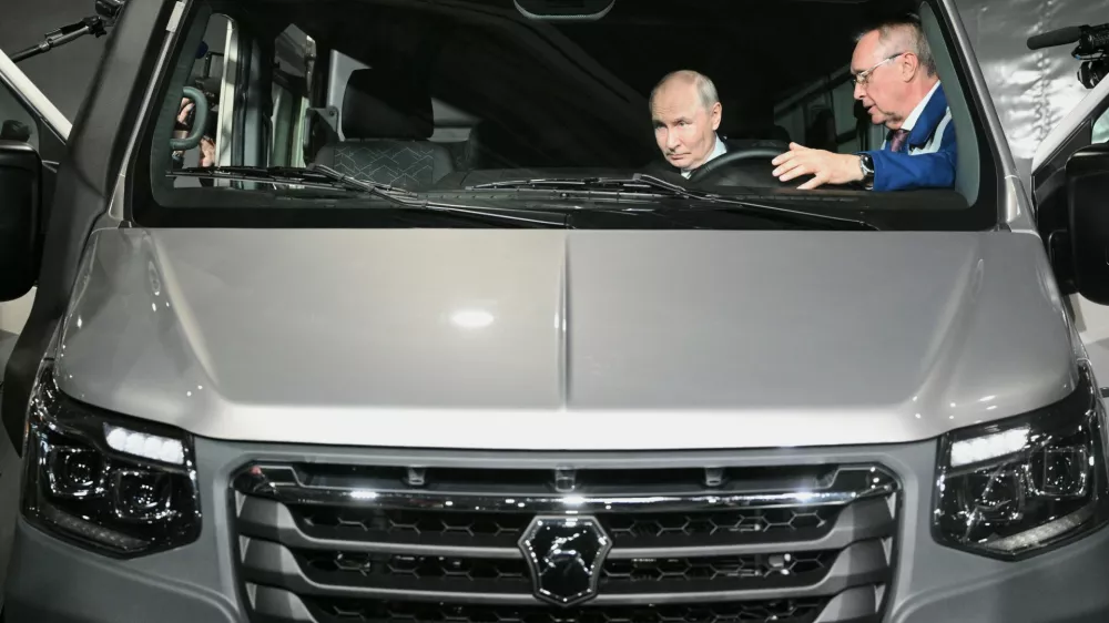 Russian President Vladimir Putin, left, visits the Nizhny Novgorod automobile cluster, in Nizhny Novgorod, Russia, Friday, Aug. 28, 2026. (Kirill Zykov/Sputnik, Kremlin Pool Photo via AP)