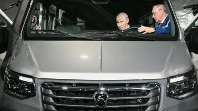 Russian President Vladimir Putin, left, visits the Nizhny Novgorod automobile cluster, in Nizhny Novgorod, Russia, Friday, Aug. 28, 2026. (Kirill Zykov/Sputnik, Kremlin Pool Photo via AP)