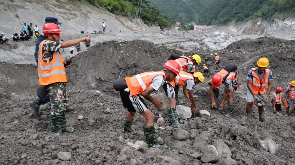 An undated handout photo of rescue workers taking part in a rescue operation near the tunnel of the Trishuli 3A Hydropower Project, following deadly flash floods and mudslides, in Rasuwa, Nepal. Nepal Army/Handout via REUTERS THIS IMAGE HAS BEEN SUPPLIED BY A THIRD PARTY. MANDATORY CREDIT. NO RESALES. NO ARCHIVES. BEST QUALITY AVAILABLE.