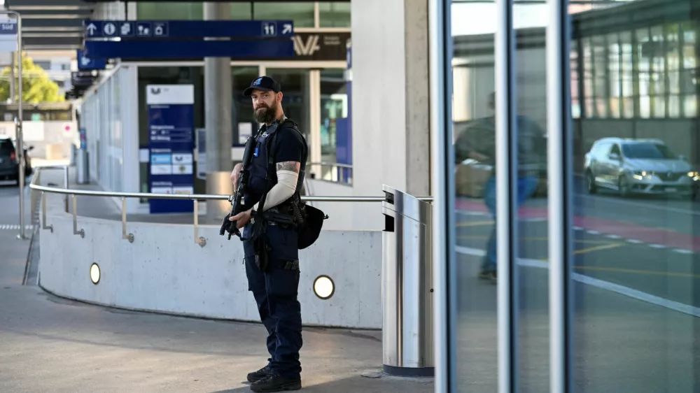 A police officer stands near the site of a deadly shooting at an event, according to the police, at a train station in Aarau, Switzerland, August 30, 2026. REUTERS/Romina Amato
