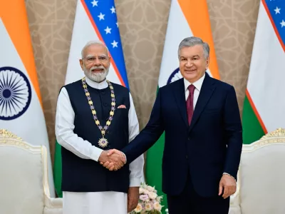 In this photo released by Uzbekistan's Presidential Press Office, Uzbekistan's President Shavkat Mirziyoyev, right, and Indian Prime Minister Narendra Modi pose for a photo during their meeting in Tashkent, Uzbekistan, on Sunday, Aug. 30, 2026. (Uzbekistan's Presidential Press Office via AP)
