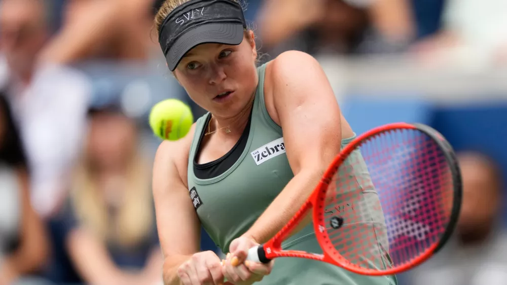 Veronika Erjavec, of Slovenia, returns the ball to Jasmine Paolini, of Italy, during the first round of the U.S. Open tennis championships Sunday, Aug. 30, 2026, in New York. (AP Photo/Yuki Iwamura)