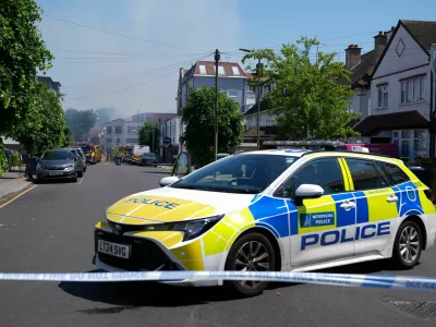 Police officers sit in a police cruiser near the scene of a fire started behind a Jewish supermarket Kosher Kingdom, in the Golders Green area of London, Britain, May 27, 2026. REUTERS/Maja Smiejkowska