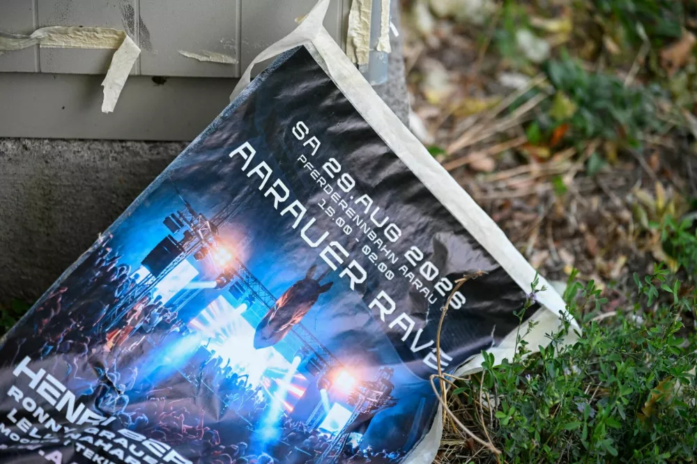 A poster for a rave party, following a deadly shooting at the rave party, according to the police, in Aarau, Switzerland, August 30, 2026. REUTERS/Romina Amato