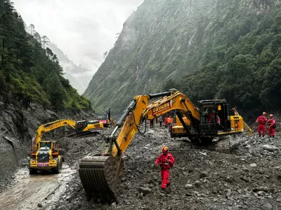 Rescue workers operate excavators and loaders to repair a damaged road leading to Gyirong Port following a mudslide, in Shigatse, Tibet Autonomous Region, China August 29, 2026. China Daily via REUTERS ATTENTION EDITORS - THIS IMAGE WAS PROVIDED BY A THIRD PARTY. CHINA OUT.   China Daily via REUTERS ATTENTION EDITORS - THIS PICTURE WAS PROVIDED BY A THIRD PARTY. CHINA OUT. NO COMMERCIAL OR EDITORIAL SALES IN CHINA.