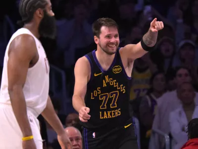 Mar 31, 2026; Los Angeles, California, USA; Los Angeles Lakers guard Luka Doncic (77) reacts after a basket in the second half against the Cleveland Cavaliers at Crypto.com Arena. Mandatory Credit: Jayne Kamin-Oncea-Imagn Images