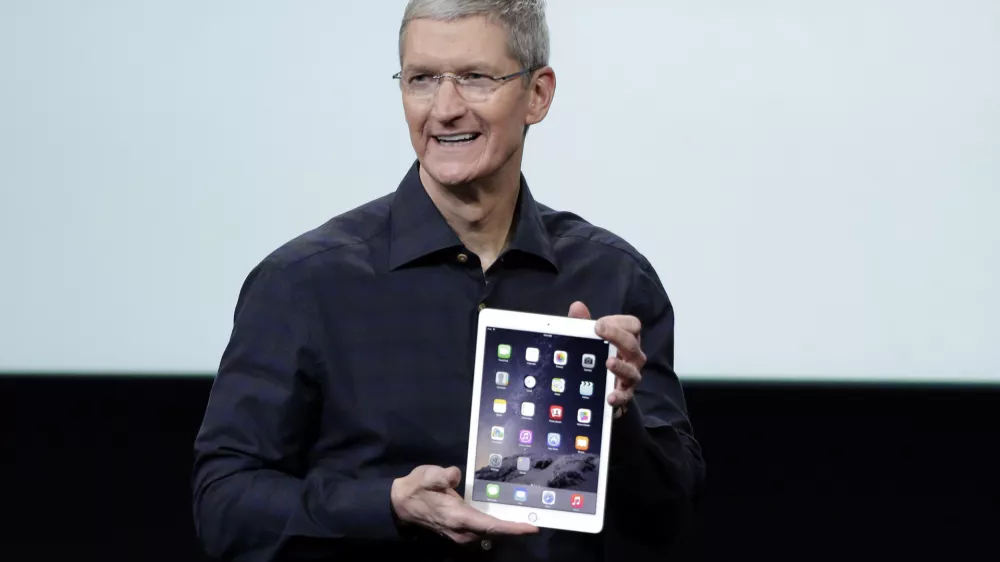 Apple CEO Tim Cook introduces the new Apple iPad Air 2 during an event at Apple headquarters on Thursday, Oct. 16, 2014 in Cupertino, Calif. (AP Photo/Marcio Jose Sanchez)
