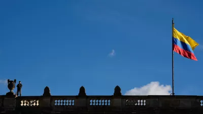 A soldier stands guard on a rooftop of Colombia's Congress before a vigil in honor of earthquake victims in Bogota, Colombia, Friday, Aug. 28, 2026. (AP Photo/Fernando Vergara)