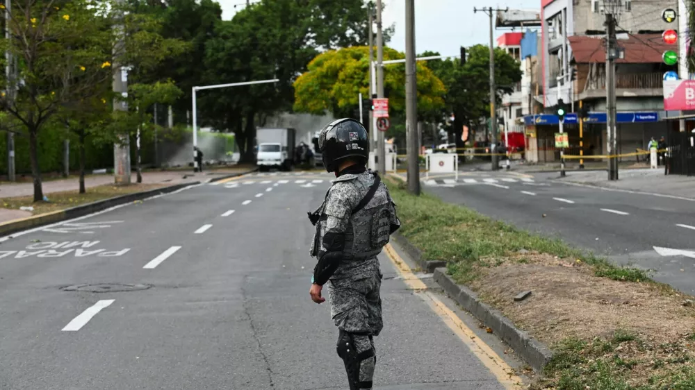 A soldier stands guard following the explosion of a cargo vehicle near an Aerospace Force base, in one of two attacks attributed to FARC dissident groups, that caused multiple casualties, according to authorities, in Cali, Colombia August 21, 2025. REUTERS/Oswaldo Paez