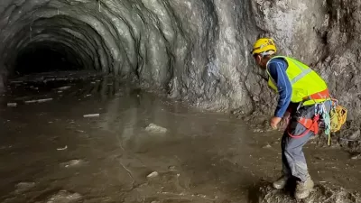 A rescuer works at the entrance of a tunnel at Chilime Hydropower Plant as rescue operations continue for people trapped inside following deadly flash floods and a mudslide, in Rasuwa, Nepal, August 29, 2026, in this screengrab obtained from a social media video. Ashish Gurung/via REUTERS THIS IMAGE HAS BEEN SUPPLIED BY A THIRD PARTY. MANDATORY CREDIT. NO RESALES. NO ARCHIVES. THIS PICTURE WAS CROPPED BY REUTERS TO ENHANCE QUALITY. AN UNCROPPED VERSION HAS BEEN PROVIDED VERIFICATION: - Reuters was able to match the building layout and mountain terrain with topography imagery of the area. - Nepal National Mountain Guide Association have said they are conducting rescue operations at the tunnel.