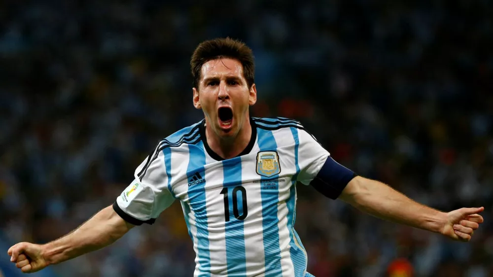 FILE PHOTO: Argentina's Lionel Messi celebrates scoring a goal during the 2014 World Cup Group F soccer match against Bosnia and Herzegovina at the Maracana stadium in Rio de Janeiro June 15, 2014. REUTERS/Michael Dalder/File Photo