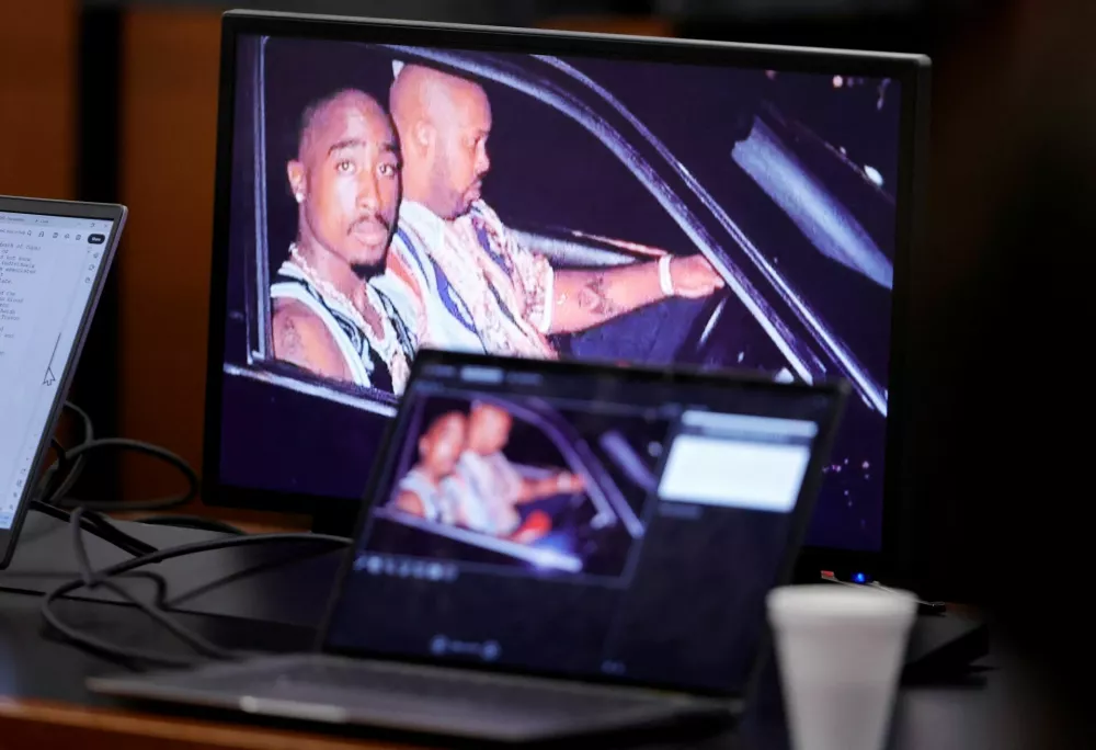 A 1996 photo of rapper Tupac Shakur and Marion "Suge" Knight is shown on screens during closing arguments in the Duane Davis murder trial, related to the 1996 killing of rapper Tupac Shakur, in Clark County District Court at the Regional Justice Center in Las Vegas, Nevada, U.S., August 31, 2026. REUTERS/Steve Marcus/Pool