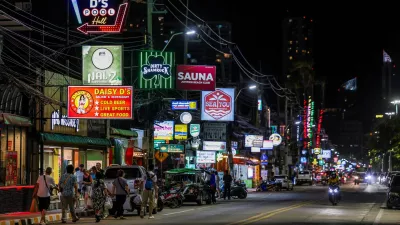 People walk along a street lined with bars and entertainment venues at Jomtien Beach, in Pattaya City, Thailand, June 29, 2026. REUTERS/Chalinee Thirasupa