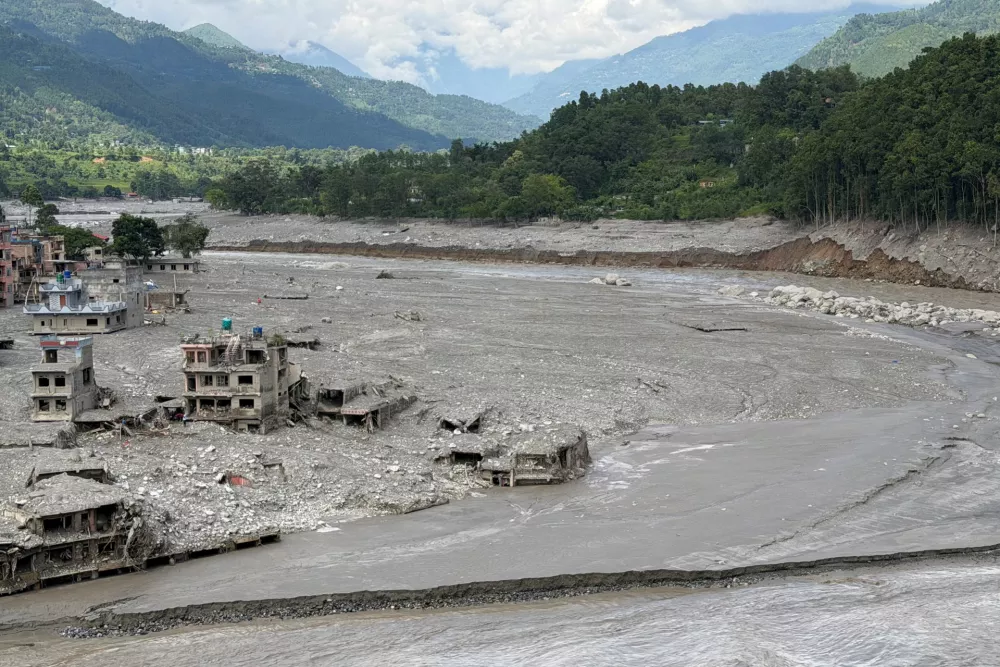 Damaged properties along the Trishuli River where the Tribhuvan Trishuli Secondary School once stood before it was destroyed in the deadly flash floods and mudslides, in Nuwakot, Nepal, August 31, 2026. Picture taken with a mobile phone. REUTERS/Sunil Kataria