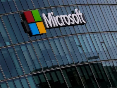 FILE PHOTO: A view shows a Microsoft logo at Microsoft offices in Issy-les-Moulineaux near Paris, France, March 21, 2025. REUTERS/Gonzalo Fuentes/File Photo