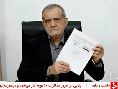 A screen grab shows Iran's President Masoud Pezeshkian holding a signed memorandum with U.S. President Donald Trump, in Tehran, Iran, June 18, 2026, taken from a video. Pool via WANA/Reuters TV/Handout via REUTERS  THIS IMAGE HAS BEEN SUPPLIED BY A THIRD PARTY. ISRAEL OUT. NO COMMERCIAL OR EDITORIAL SALES IN ISRAEL. NO USE BBC PERSIAN. NO USE VOA PERSIAN. NO USE MANOTO. NO USE IRAN INTERNATIONAL. NO USE RADIO FARDA, NO USE ISRAEL. FOR REUTERS CUSTOMERS ONLY. OVERLAYS FROM SOURCE.   TPX IMAGES OF THE DAY