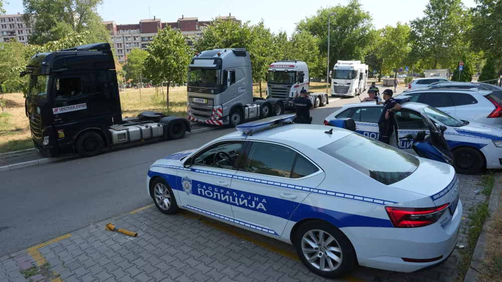 Serbian police guard the EU delegation building during a protest by truckers against travel bans imposed on Balkan truck drivers to work in European Union countries, in Belgrade, Serbia, Monday, Aug. 31, 2026. (AP Photo/Darko Vojinovic)