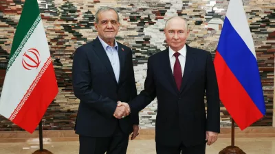 Russian President Vladimir Putin, right, and Iranian President Masoud Pezeshkian pose for a photo during their meeting on the sidelines of the Shanghai Cooperation Organization (SCO), in Bishkek, Kyrgyzstan, on Tuesday, Sept. 1, 2026. (Vyacheslav Prokofyev, Sputnik, Kremlin Pool Photo via AP)