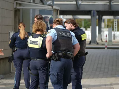 Police officers are stationed near Augsburg's main train station in Augsburg, Germany, Wednesday, Sept. 2, 2026. (Felix Kirberg/dpa via AP)