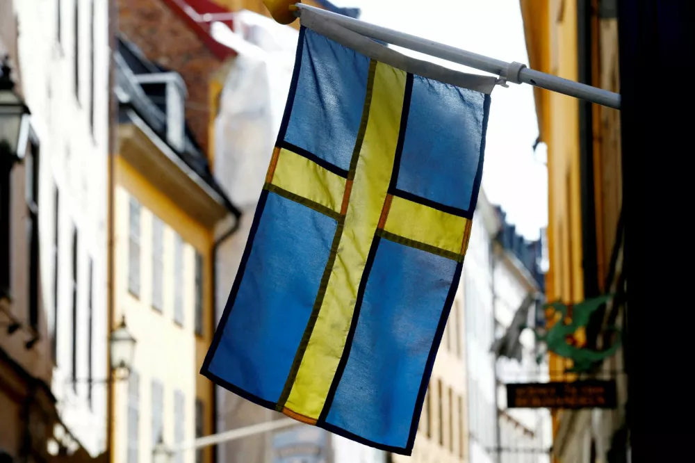 FILE PHOTO: The Swedish flag is seen at Gamla Stan, the Old City of Stockholm, Sweden, May 7, 2017. REUTERS/Ints Kalnins/File Photo
