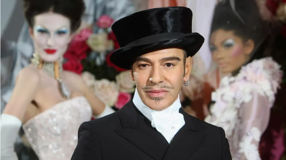 FILE - Fashion designer John Galliano poses at the end of the presentation of the Dior Haute Couture spring/summer 2010 fashion collection on Jan. 25, 2010, in Paris. (AP Photo/Jacques Brinon, File)