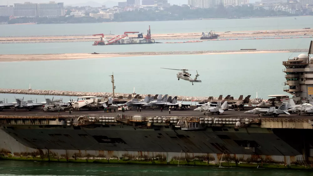A helicopter lands on the U.S. Navy aircraft carrier USS Abraham Lincoln after it arrived at the port in Laem Chabang, Chonburi, Thailand, Wednesday, Sept. 2, 2026. (AP Photo/Sakchai Lalit)