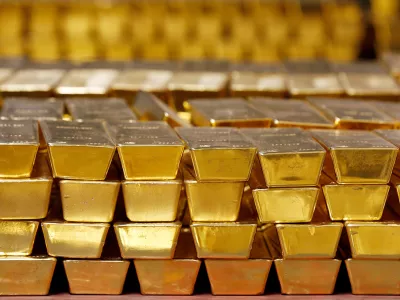 FILE - Gold bars are stacked in a vault at the United States Mint on July 22, 2014, in West Point, N.Y. (AP Photo/Mike Groll, File)