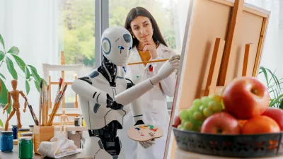 Creative AI robot learning how to paint on canvas in the art studio, a young teacher is training her