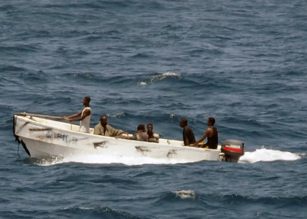 ** FILE ** In this photo provided by the U.S. Navy, pirates leave the Ukrainian merchant vessel MV Faina for Somalia's shore Wednesday, Oct. 8, 2008 while under observation by a U.S. Navy ship. The MV Faina which is carrying a cargo of Ukrainian T-72 tanks and related military equipment, was seized by pirates Sept. 25 and forced to proceed to anchorage off the Somali coast. (AP Photo/U.S. Navy, Petty Officer 2nd Class Jason R. Zalasky)