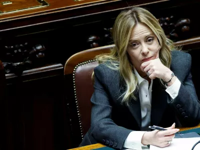 FILE PHOTO: Italy's Prime Minister Giorgia Meloni listens to debate, after she reported on her government's actions and is expected to speak on the latest developments in Iran, at the lower house of Parliament in Rome, Italy, April 9, 2026. REUTERS/Remo Casilli/File Photo