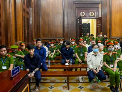 This photograph taken on December 24, 2024 shows the trial of drug traffickers inside the People's Court in Ho Chi Minh City. A court in Vietnam sentenced 27 people to death on December 27 after finding them guilty of trafficking more than 600 kilos of narcotics including heroin, ketamine and methamphetamine, state media reported.,Image: 950378133, License: Rights-managed, Restrictions:, Model Release: no 