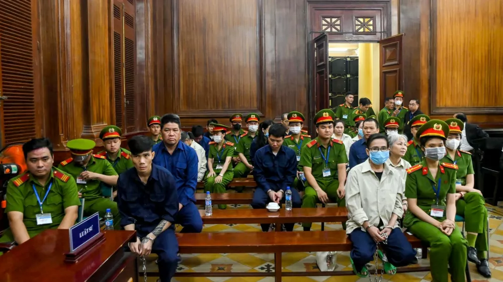 This photograph taken on December 24, 2024 shows the trial of drug traffickers inside the People's Court in Ho Chi Minh City. A court in Vietnam sentenced 27 people to death on December 27 after finding them guilty of trafficking more than 600 kilos of narcotics including heroin, ketamine and methamphetamine, state media reported.,Image: 950378133, License: Rights-managed, Restrictions:, Model Release: no 