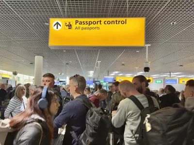 Amsterdam, Netherlands - June 5, 2025: Passengers waiting in a queue to clear Passport Control at Schiphol Airport, Amsterdam.