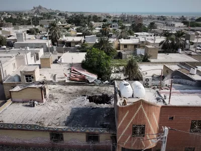 An aerial view shows the apparent point of impact on the roof of a building that Iranian media said was hit by a U.S. strike while a wedding celebration was taking place there, in Kuhestak, southern Iran, Wednesday, Sept. 2, 2026. (Morteza Akhoondi/Tasnim News Agency via AP)