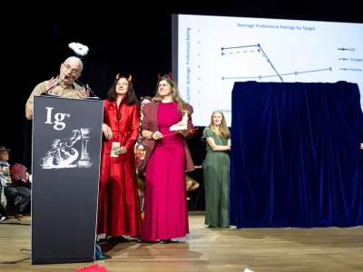 Peace Prize winners, from left, Daniel Sznycer, Keelah Williams and Jaimie Arona Krems, speak during the Ig Nobel Prize ceremony held in the Zurich Convention Center in Zurich, Switzerland, on Thursday, Sept. 3, 2026. (Claudio Thoma/Keystone via AP)
