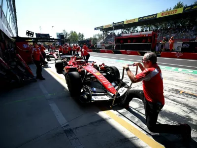 Formula One F1 - Italian Grand Prix - Autodromo Nazionale Monza, Monza, Italy - September 4, 2026 Ferrari's Charles Leclerc and Ferrari's Lewis Hamilton in the pits after practice REUTERS/Guglielmo Mangiapane