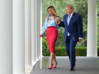 President Donald Trump, right, and first lady Melania Trump walk to attend an event in the Rose Garden of the White House, Thursday, Aug. 20, 2026, in Washington. (AP Photo/Jacquelyn Martin)