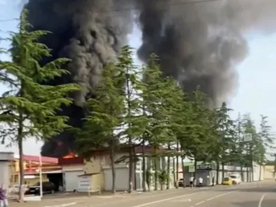 Smoke rises from an oil depot after a reported Ukrainian drone strike, in Krasnodar Krai, Russia, September 4, 2026, in this screengrab obtained a from social media video. Social Media/via REUTERS THIS IMAGE HAS BEEN SUPPLIED BY A THIRD PARTY. NO RESALES. NO ARCHIVES. NEWS USE ONLY.  Verification Lines: Reuters verified the location from buildings, trees, road signs and road layout which matched archive and satellite imagery. Location of fire: 43.43425955252491, 39.93569264949287. The date was confirmed by local authorities in the Krasnodar region saying on Telegram that a Ukrainian drone strike caused a fire at an oil depot. NASA Firms also detected thermal activity at the location on September 4. No older versions of the video found posted online before September 4.