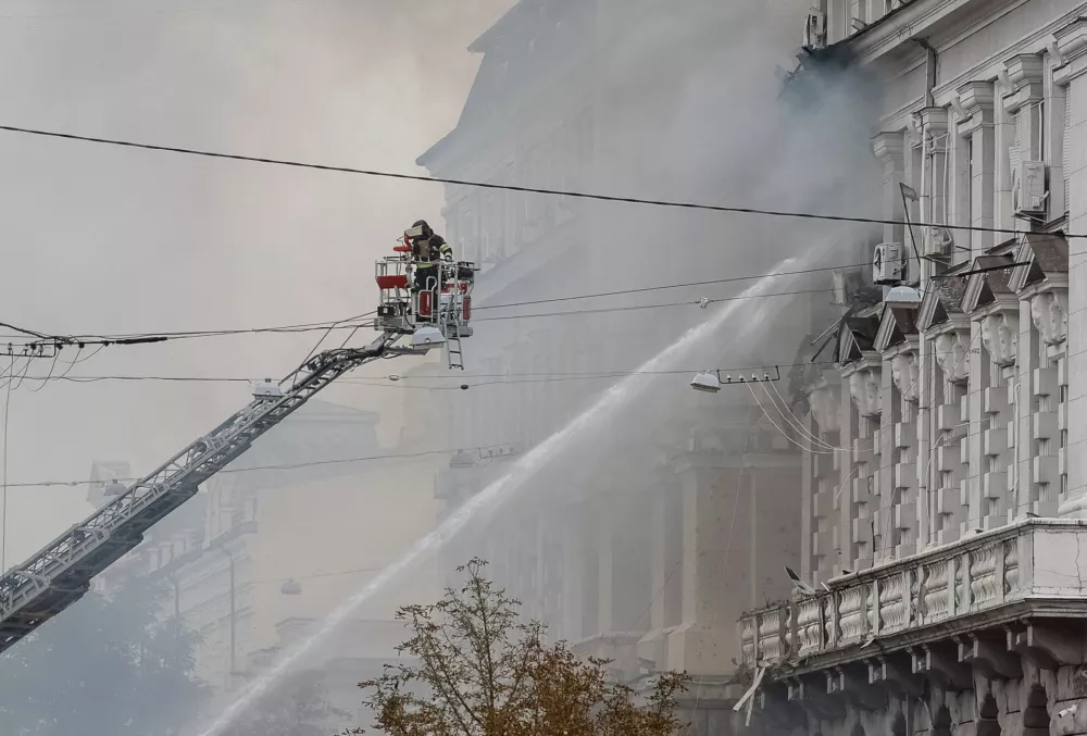 A firefighter works at a site of a building of the headquarters of Ukraine's SBU security service after a Russian drone strike, amid Russia's attack on Ukraine, in Kyiv, Ukraine September 4, 2026. REUTERS/Gleb Garanich