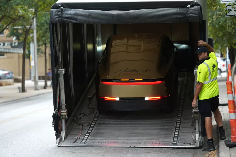 A Tesla Cybercab is unloaded in downtown Austin, Texas, Thursday, Sept. 3, 2026. (AP Photo/Eric Gay)