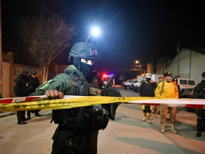 A police officer holds a caution tape after explosions that left people dead and injured at the "Bolivar" Mechanized Artillery Regiment, in Viacha, Bolivia, September 4, 2026. REUTERS/Claudia Morales