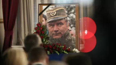A photo of former Bosnian Serb wartime general Ratko Mladic is displayed during a commemoration ceremony in Belgrade, Serbia, Saturday, Sept. 5, 2026. (AP Photo/Darko Vojinovic)